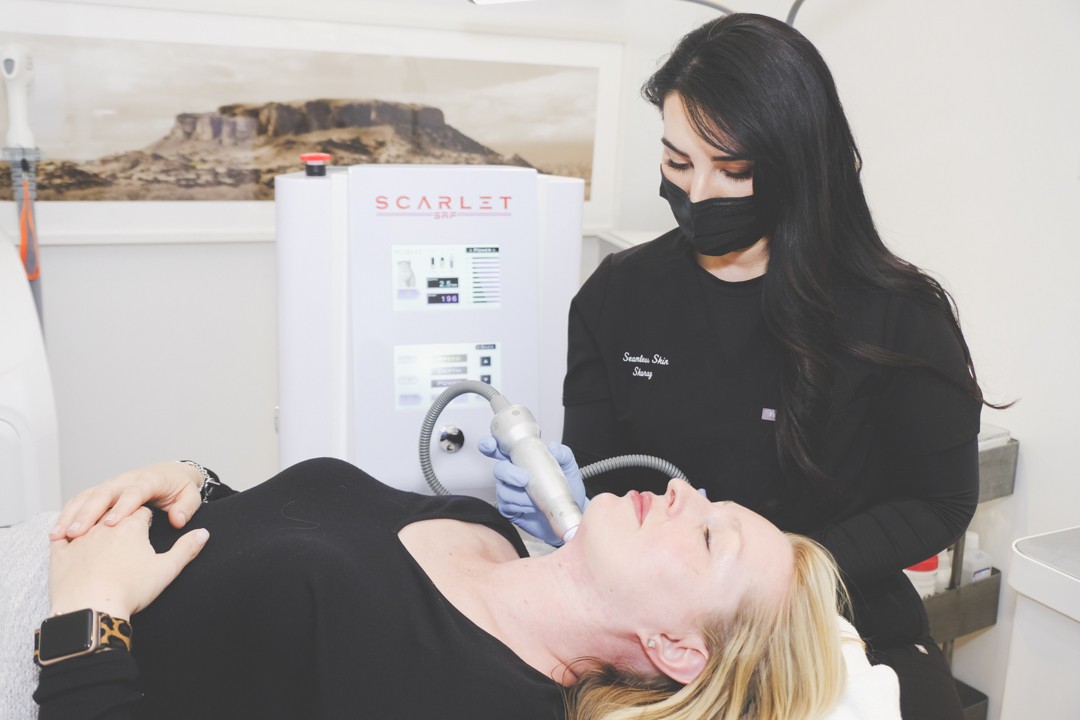 Staff using Scarlet Microneedling 2