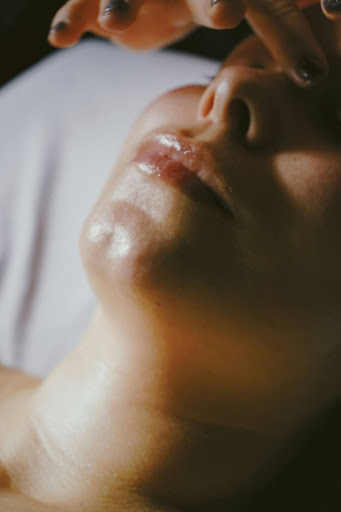 Close-up view of a person's face during a skincare treatment, highlighting the rejuvenating effects of a Hydrafacial at Seamless Skin MD in Santa Fe.