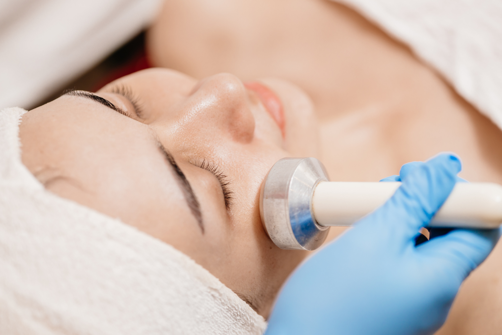 a woman getting a facial tightening santa fe procedure done