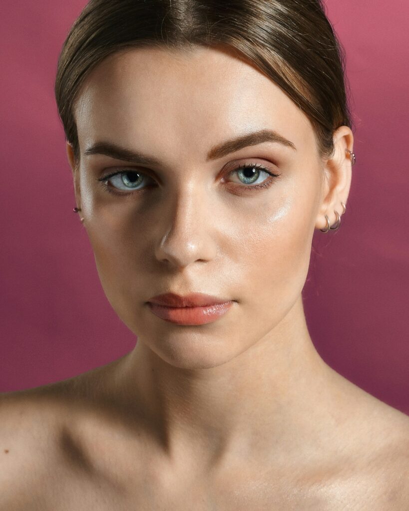 a woman posing after cosmetic injectable treatments