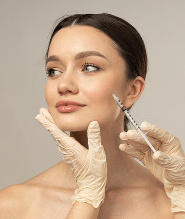 Woman receiving a cosmetic injection during a Botox or Dysport treatment at Seamless Skin M.D.