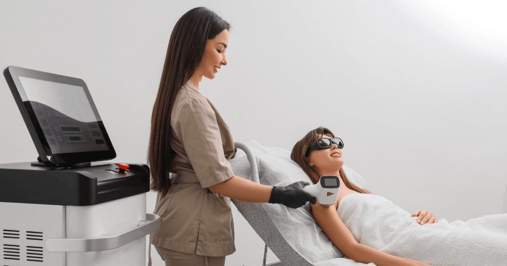 Woman receiving laser treatment in clinic. Benefits of IPL on Face