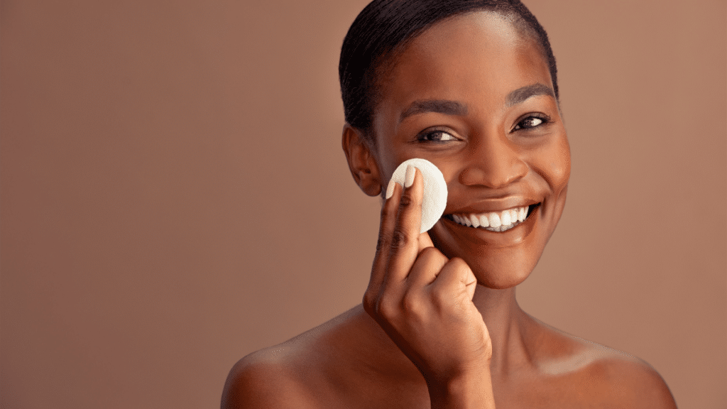 Smiling woman applying skincare santa fe product